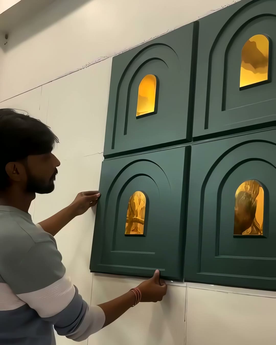 Real G&K Sons install — Arch / Niche 3D panels being fitted by hand on a bare wall